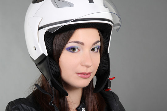 Young woman in helmet on head