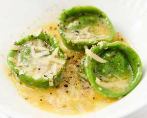 Green ravioli in plate close-up