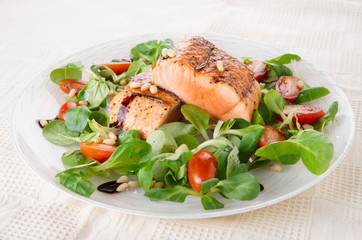 Rare fried salmon steaks in plate