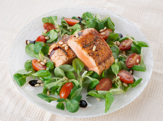 Rare fried salmon steaks in plate