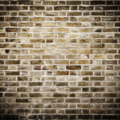 Grunge brick wall, square photograph with vignette