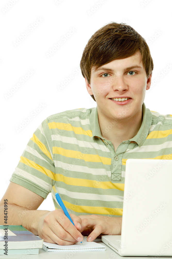 Wall mural a young guy in front of a laptop studying