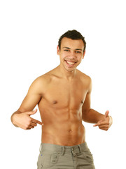 Fototapeta premium A muscular man showing his abs, isolated on white