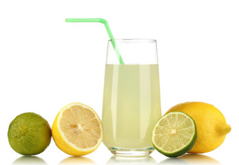 Delicious lemon juice in glass and limes and lemons next to it