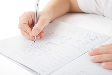 Naklejka premium Child hands writing a homework