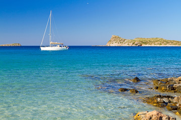 White yacht on the idyllic beach lagoon of Crete, Greece