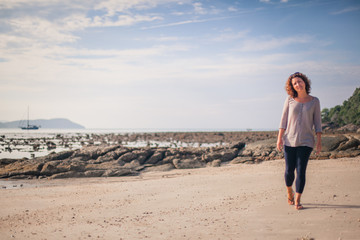 Girl walking along the beach