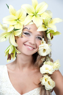 portrait of a beautiful girl with a garland of lilies and eustom