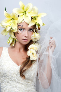 portrait of a beautiful girl with a garland of lilies and eustom