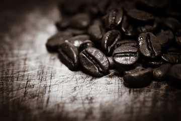 Coffee beans on grunge wooden background