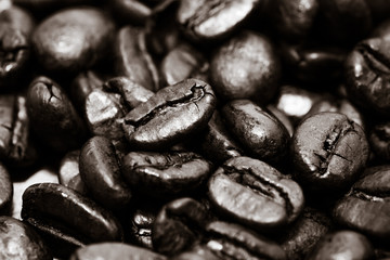 Coffee beans on grunge wooden background