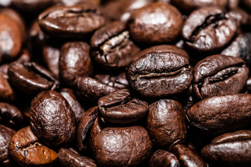 Coffee beans on grunge wooden background