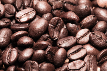 Coffee beans on grunge wooden background