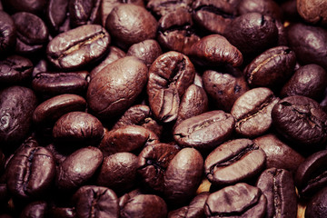 Coffee beans on grunge wooden background