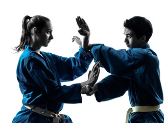 Fotobehang Vechtsport karate vietvodao vechtsporten man vrouw paar silhouet