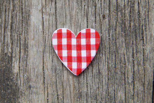 Heart over a wooden background