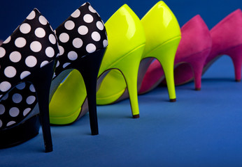 Colorful high heels on blue background