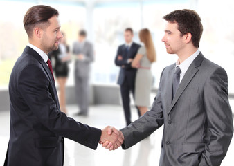 Fototapeta premium business people shaking hands over a deal