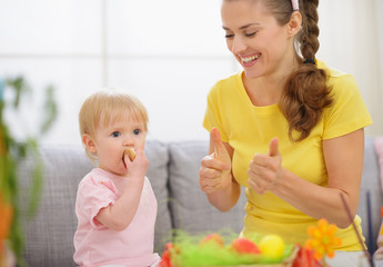 Baby and mother spending time together on Easter