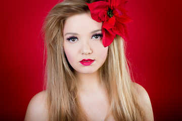 woman with red lips and red flower on her face