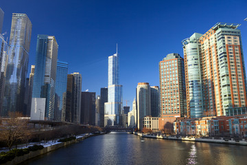 Chicago River with urban skyscrapers and riverwalk, IL, USA