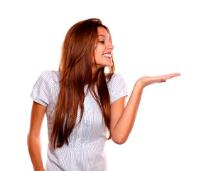 Smiling young woman holding out her palm