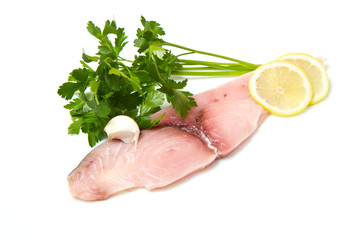 swordfish with lemon and parsley on white