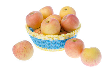 Basket full of apples isolated on white