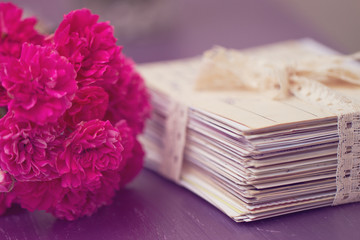 stack of old letters with roses