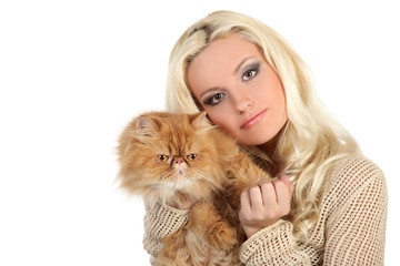 Young woman hugging a large soft red cat