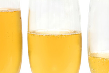 three glasses of champagne on a white background