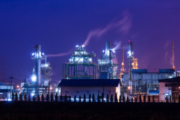 oil refinery plant and smoke at twilight morning