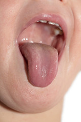 Fototapeta premium tongue out of his mouth of the child