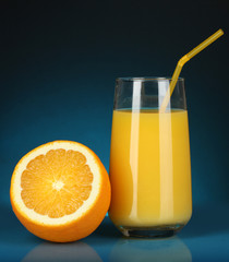 Delicious orange juice in glass and orange next to it