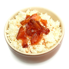cottage cheese in bowl with homemade tangerine jam, isolated
