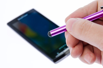 Capacitive pen and smartphones on white background