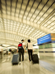 Passengers walk at the Beijing International Airport