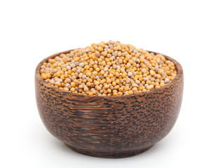 mustard seeds in a wooden bowl