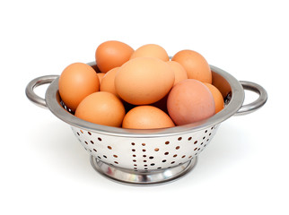 metal colanger with eggs