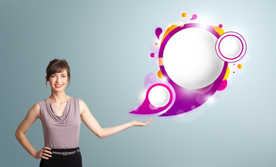 Attractive woman presenting abstract speech bubble copy space