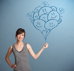 Happy woman holding smiling balloons drawing
