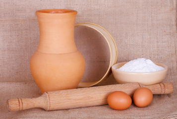 Flour, eggs and kitchen utensil