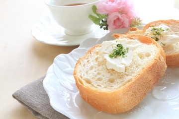 Fototapeta na wymiar french bread, baguette slided with butter and herb