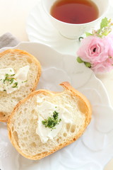 french bread, baguette slided with butter and herb