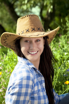 Smiling woman in cowboy hat
