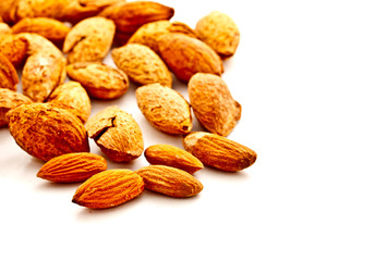 group of almond nuts on white background