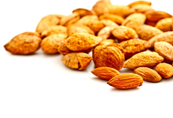 group of almond nuts on white background