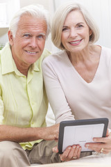 Senior Man & Woman Couple Using Tablet Computer