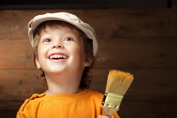 happy boy with paint brush