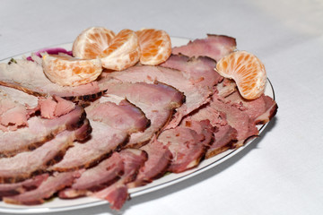 slices of the pickled ham, the neck and the bacon